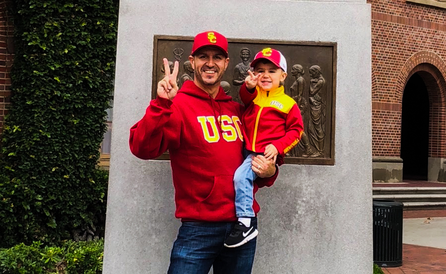 Mr. B and his son in front of the USC Trojan statue.