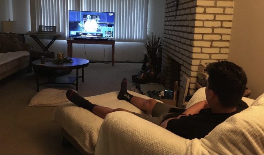Senior Steven Sanderson watches TV from the comfort of his home