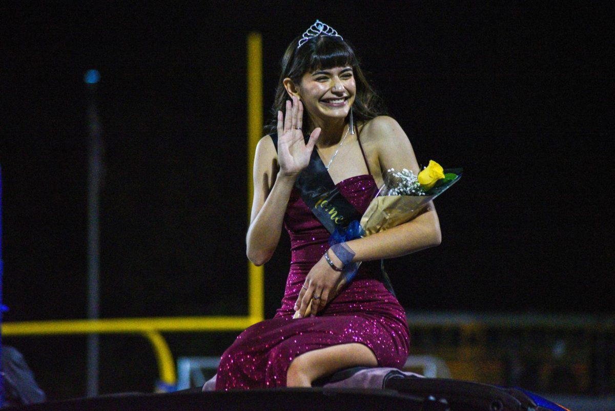 Homecoming Queen Priscilla Romero riding in style at the halftime show.