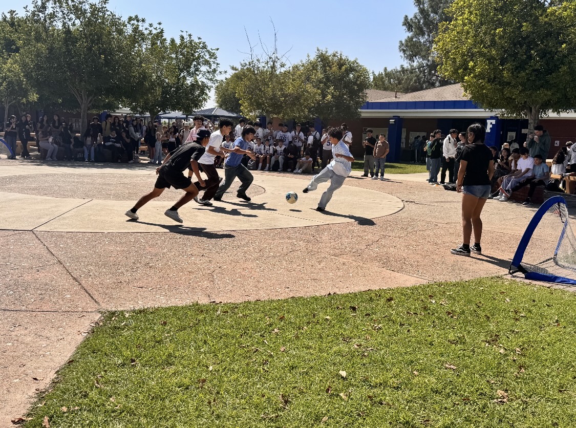 Students in the quad participate in a 3-on-3 soccer event for Hispanic Heritage Month.