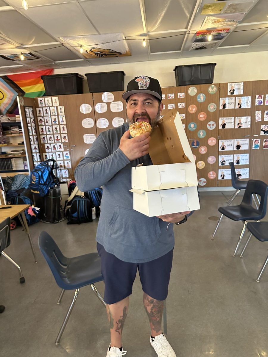 Mr. D eating a donut