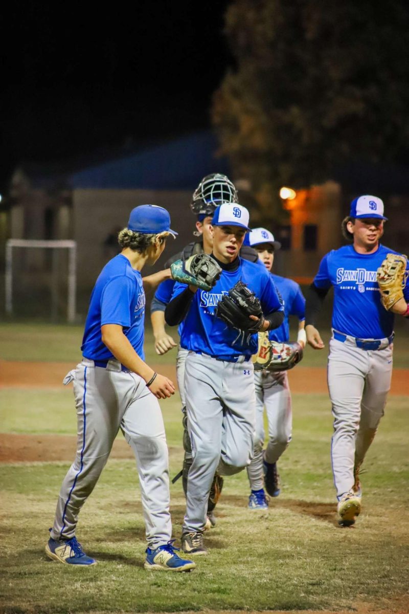 Infield walking into dugout after inning