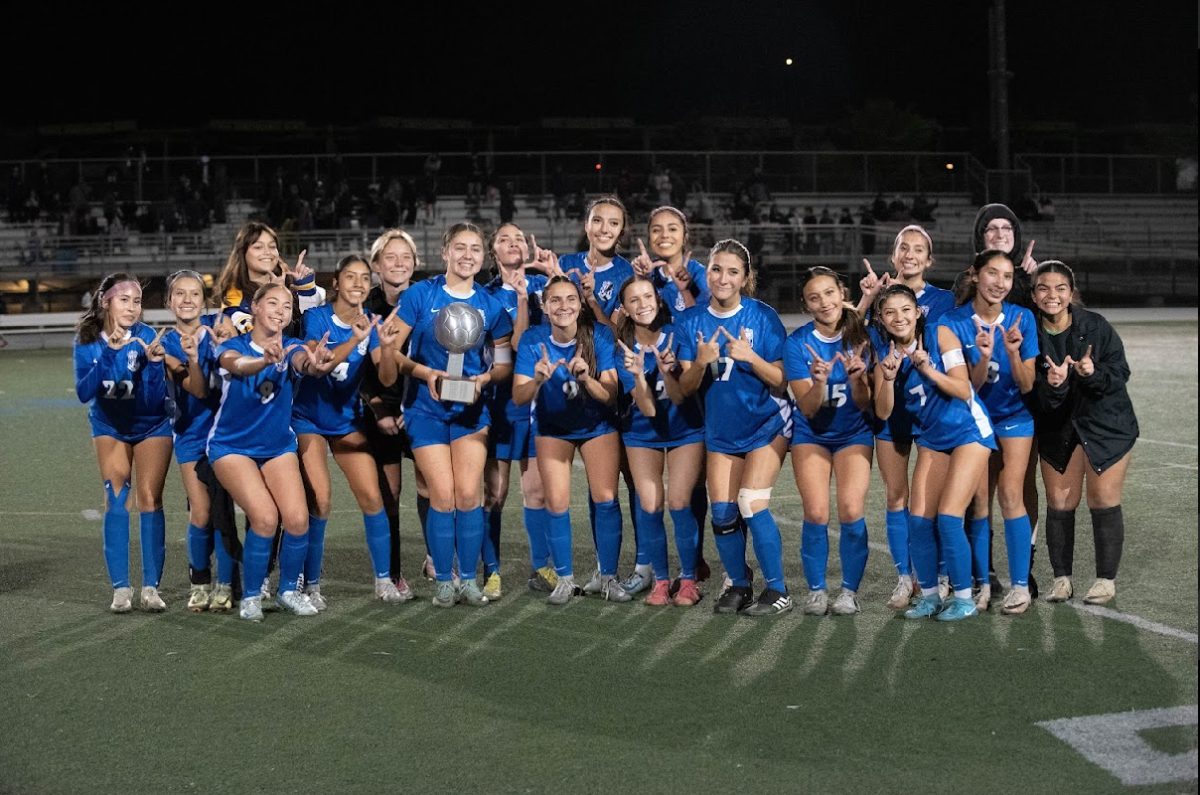 The girls holding their Smudgecup trophy after a great win against Bonita.