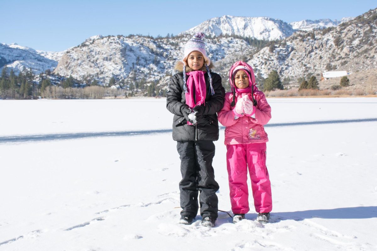 Oviya Piratheepan (12) when she was younger with her little sister in the snow. 